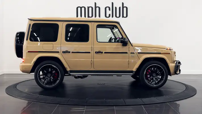 Sand with white interior Mercedes Benz G63 AMG G Wagon rental side view turntable mph club