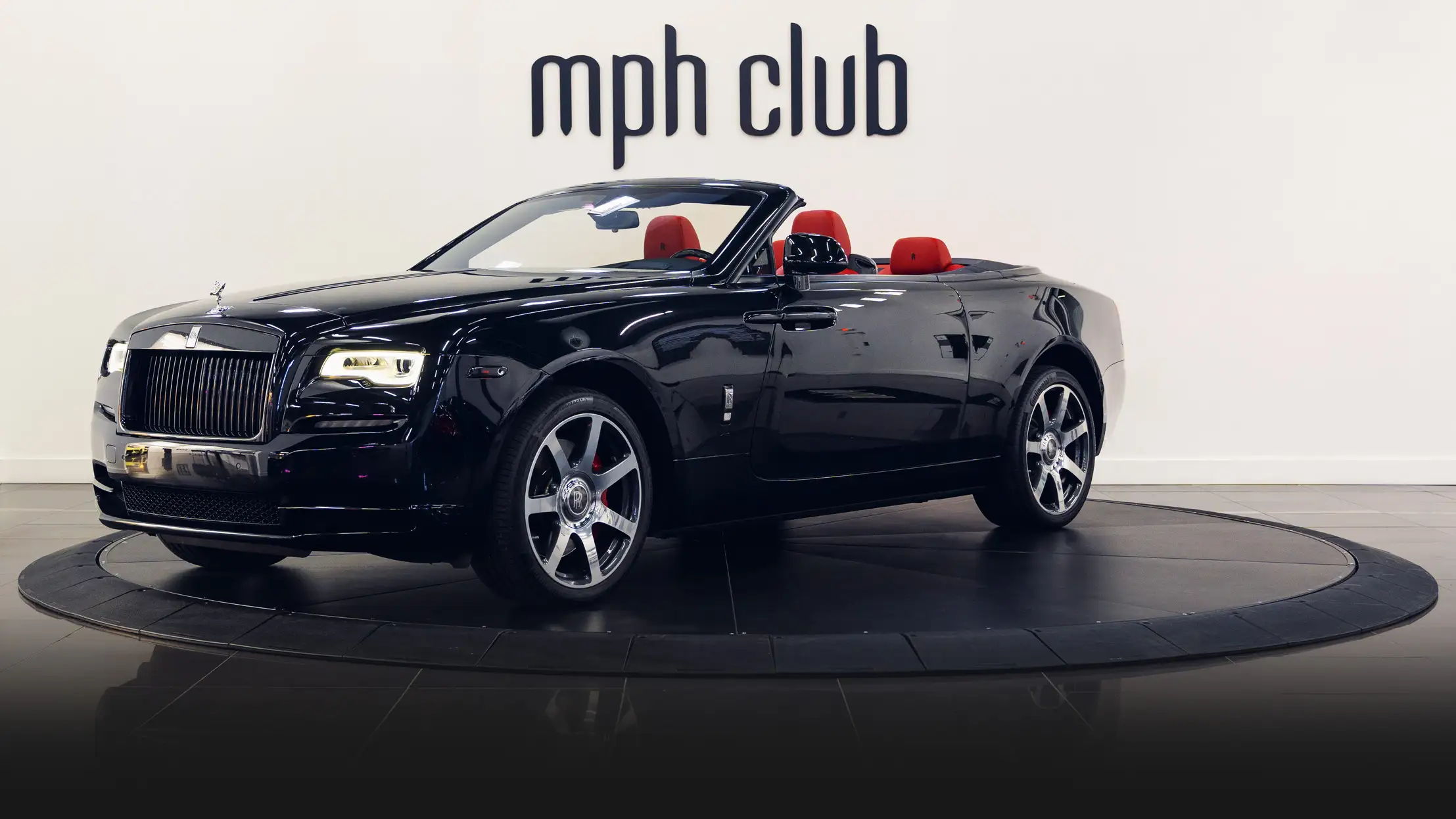 Black Rolls Royce Dawn rental profile view turntable mph club