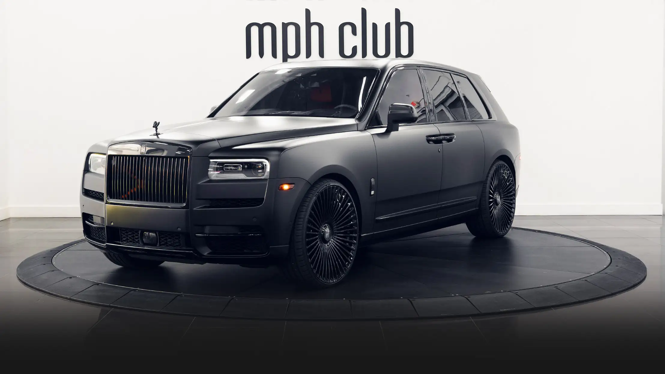 Matte black Rolls Royce Cullinan rental profile view mph club
