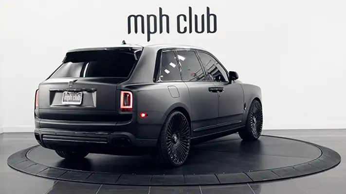 Matte black Rolls Royce Cullinan rental rear view mph club
