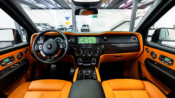 Black on orange Rolls Royce Cullinan black badge rental dashboard view mph club