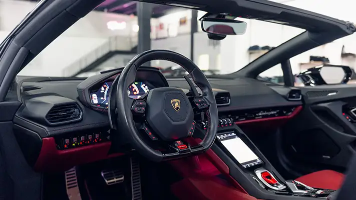 Black on red Lamborghini Huracan Evo Spyder rental dashboard view mph club turntable