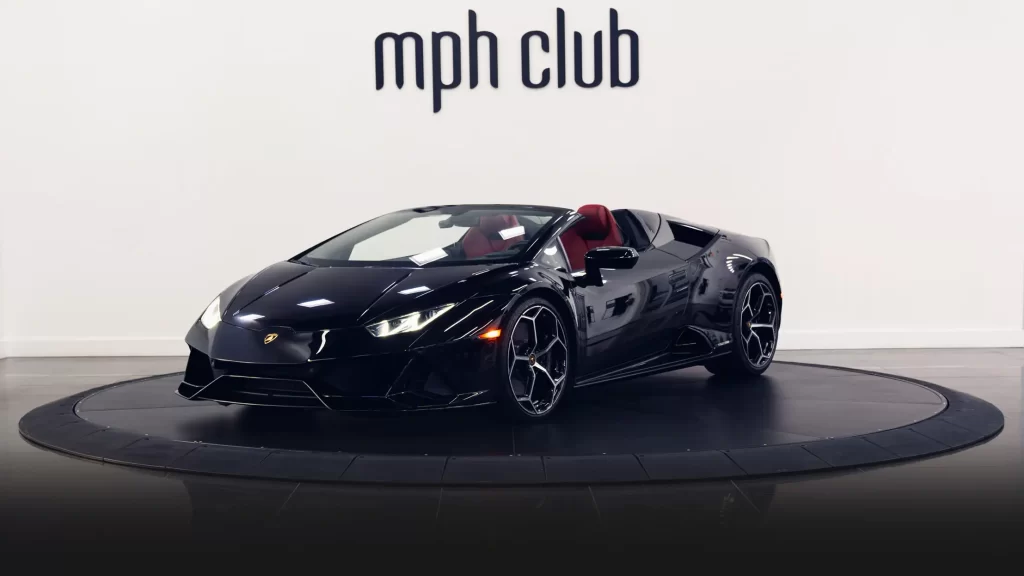 Black on red Lamborghini Huracan Evo Spyder rental profile view mph club turntable