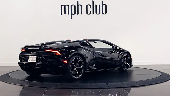Black on red Lamborghini Huracan Evo Spyder rental rear view mph club turntable