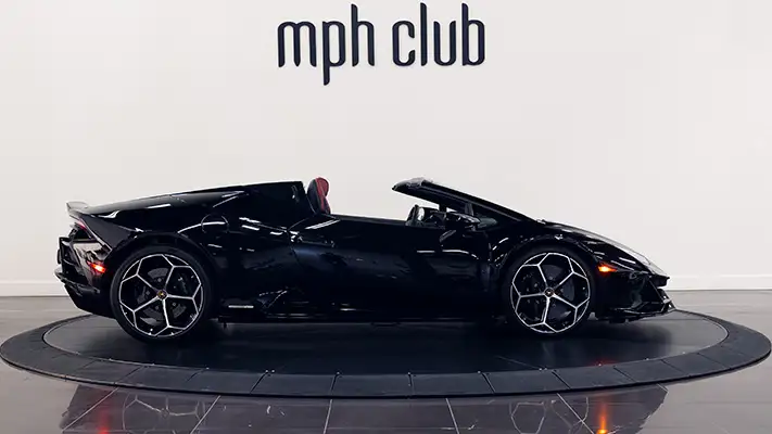 Black on red Lamborghini Huracan Evo Spyder rental side view mph club turntable