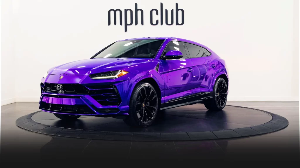 Purple Lamborghini Urus rental profile view mph club