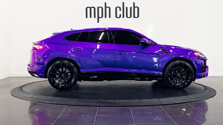 Purple Lamborghini Urus rental side view mph club