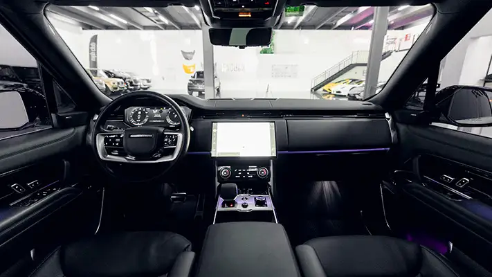 White Range Rover rental Miami dashboard view mph club