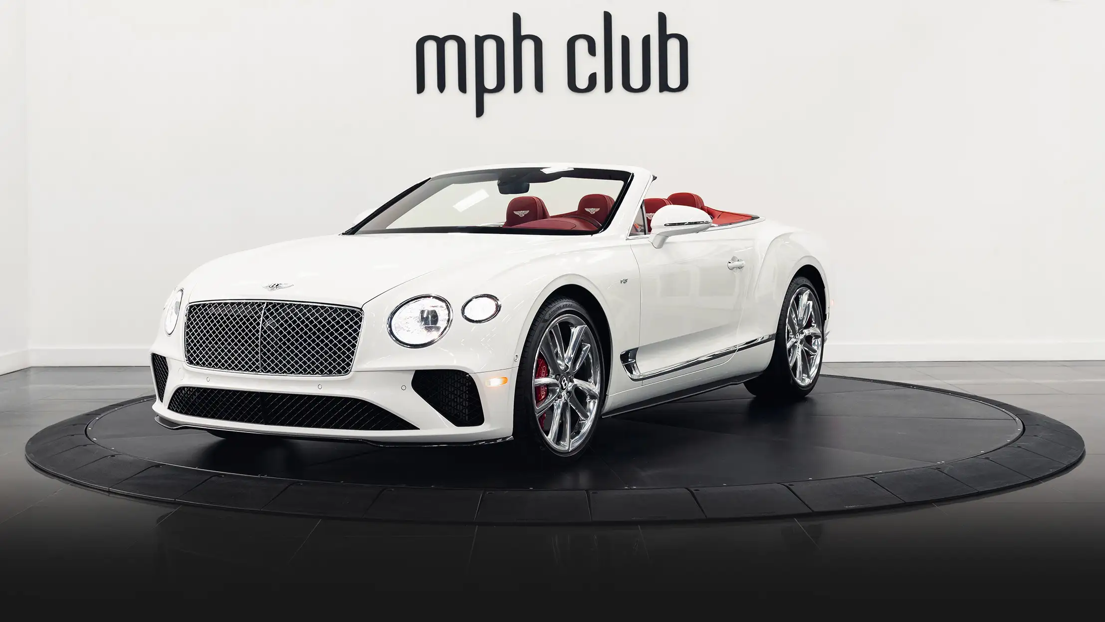 White with red Bentley Continental GTC rental profile view mph club