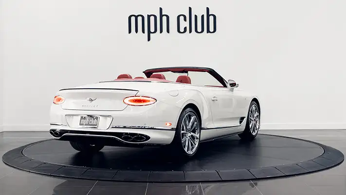 White with red Bentley Continental GTC rental rear view mph club