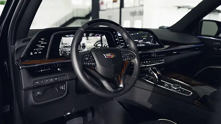 Black Cadillac Escalade rental dashboard view turntable mph club