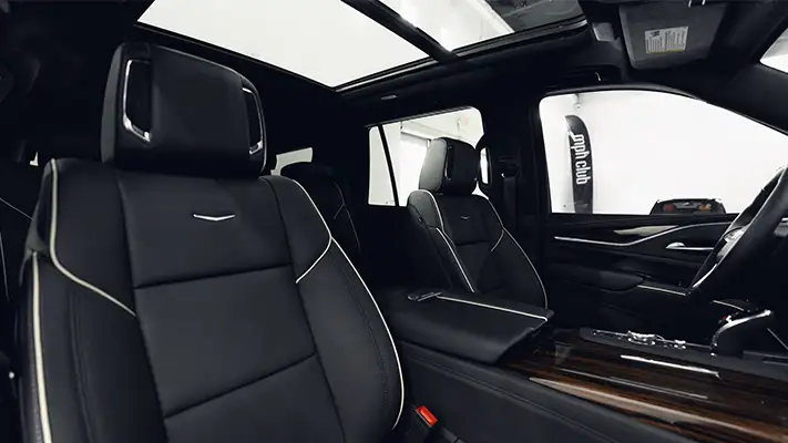 Black Cadillac Escalade rental interior view turntable mph club