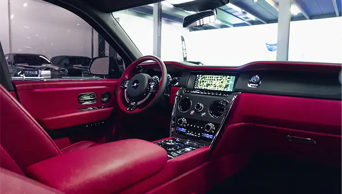 Black on pink Rolls Royce Cullinan rental dashboard view mph club