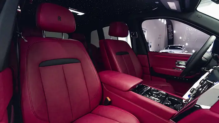 Black on pink Rolls Royce Cullinan rental interior view mph club