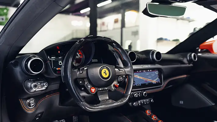 Red Ferrari Portofino rental dashboard view mph club
