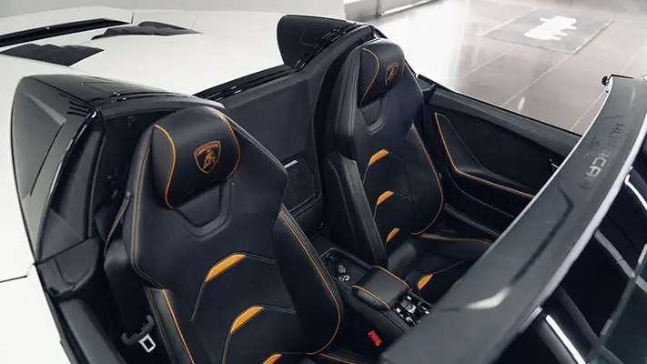 White matte Lamborghini Huracan EVO Spyder rental interior view turntable mph club