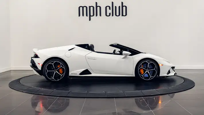 White matte Lamborghini Huracan EVO Spyder rental side view turntable mph club