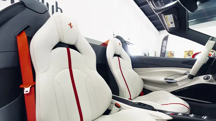 Red with white Ferrari F8 Spider rental interior view - mph club