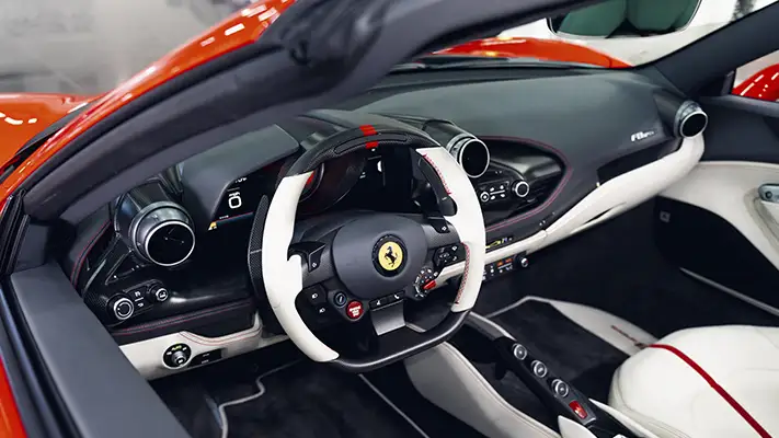 Red with white Ferrari F8 Spider rental dashboard view - mph club