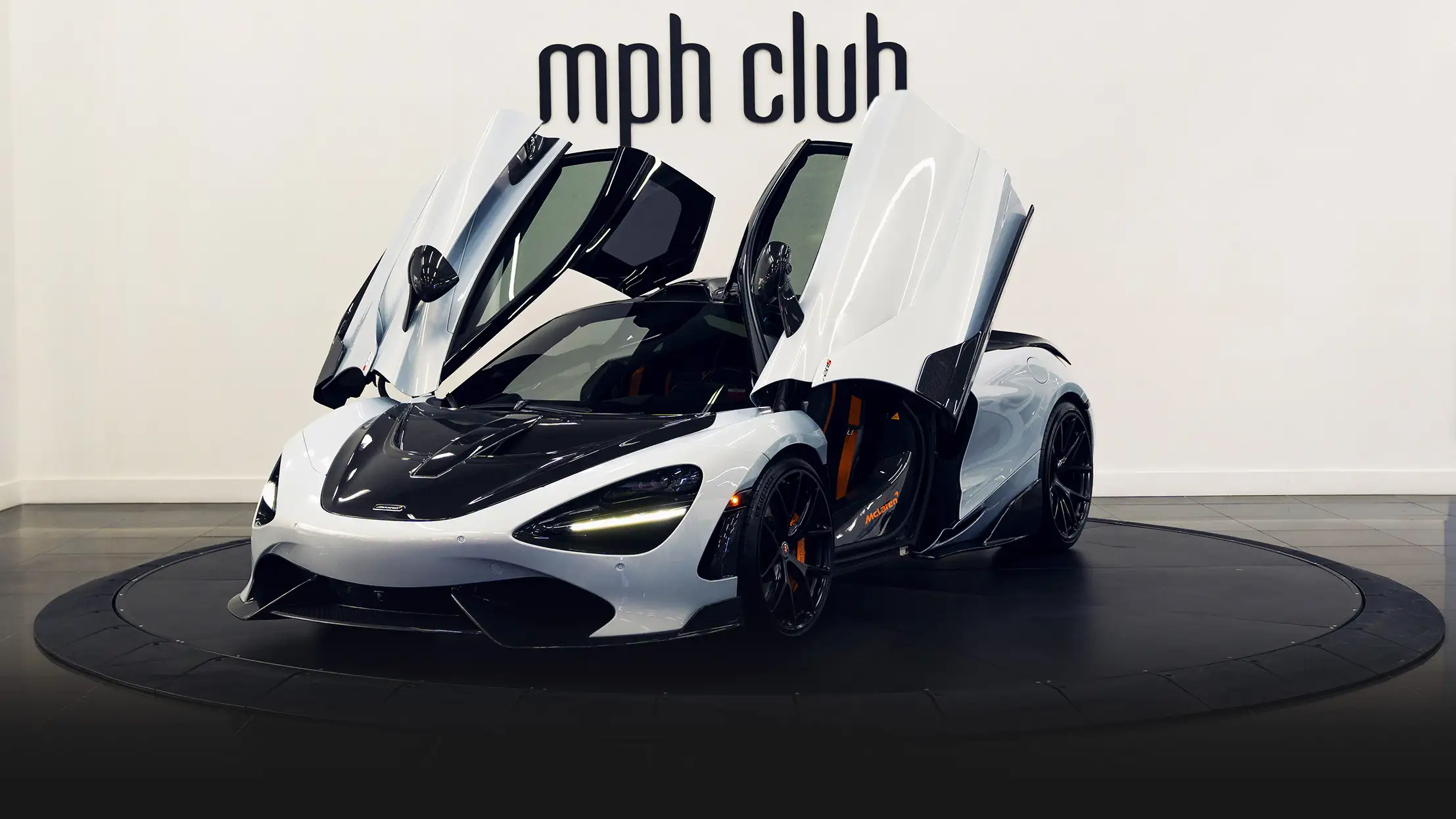 White with orange McLaren 720s rental profile view - mph club 2
