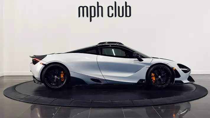 White with orange McLaren 720s rental side view - mph club