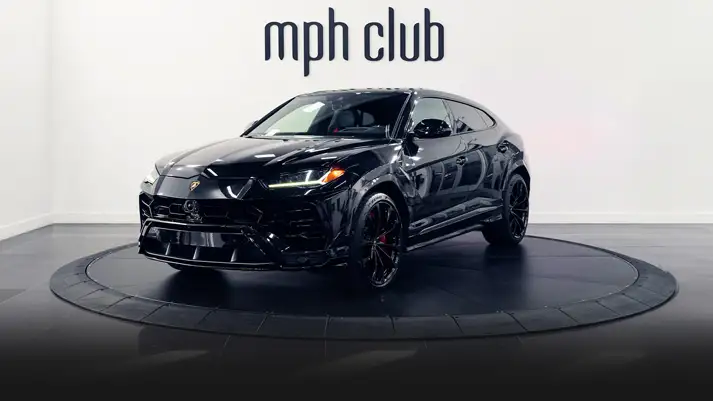 Black on red Lamborghini Urus rental profile view turntable rszd - mph club