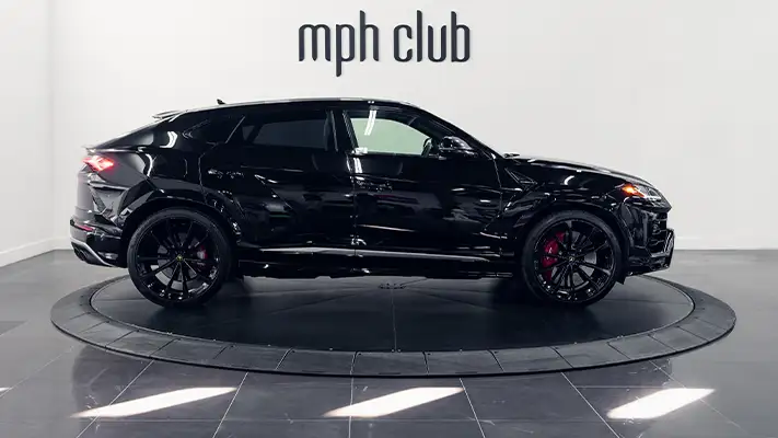 Black on red Lamborghini Urus rental side view turntable - mph club