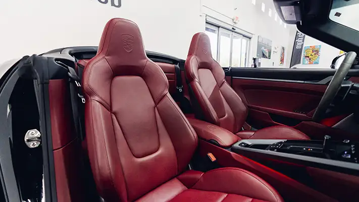 Black Porsche 911 Carrera Cabriolet rental interior view - mph club