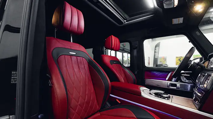 Black with red Mercedes Benz G63 AMG G Wagon rental interior view - mph club