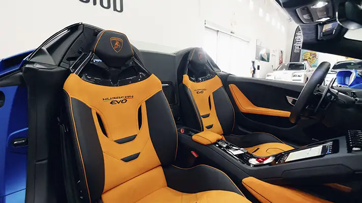 Blue matte Lamborghini Huracan EVO Spyder rental interior view - mph club