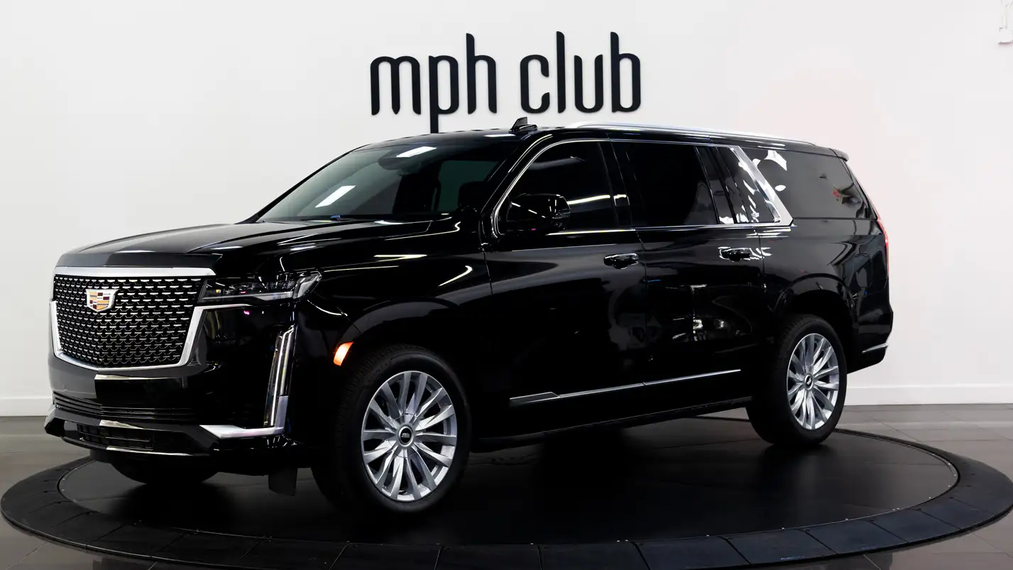 Full length and exterior of one of the Escalade options that mph club offers for rent.