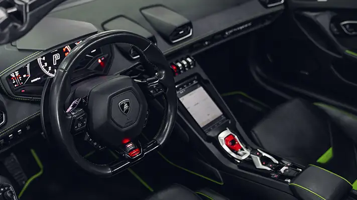 Green on black Lamborghini Huracan EVO Spyder rental dashboard view - mph club