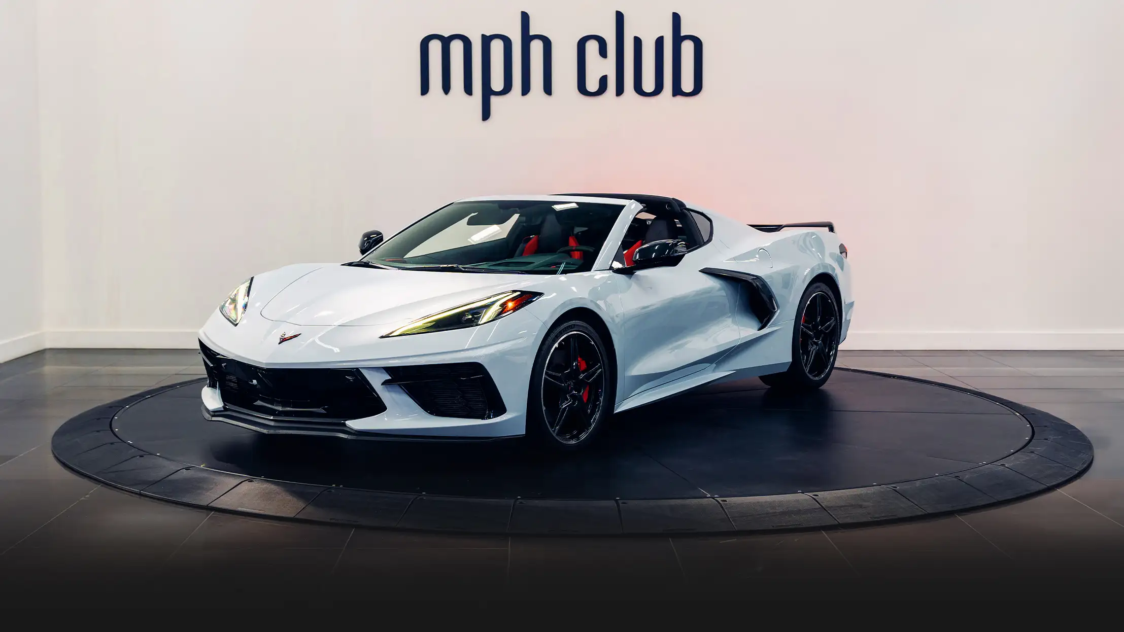 White Chevrolet Corvette C8 rental profile view turntable - mph club