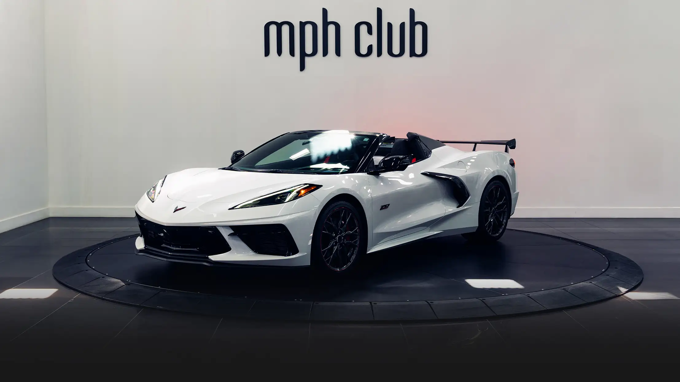 White on white Chevrolet Corvette C8 rental profile view - mph club