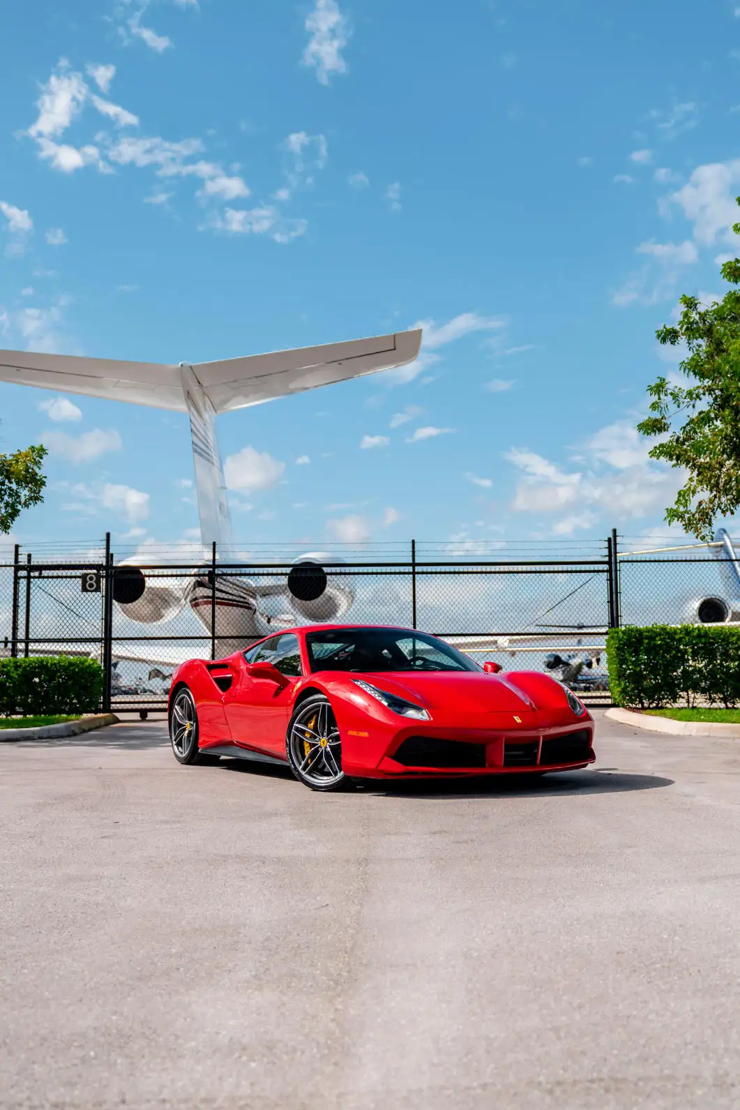 Ferrari 488 next to a private plane: the luxuriousness of the two industries create a respected reputation for business.