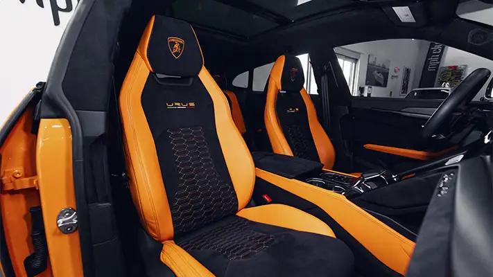 Orange Lamborghini Urus SUV rental interior view - mph club