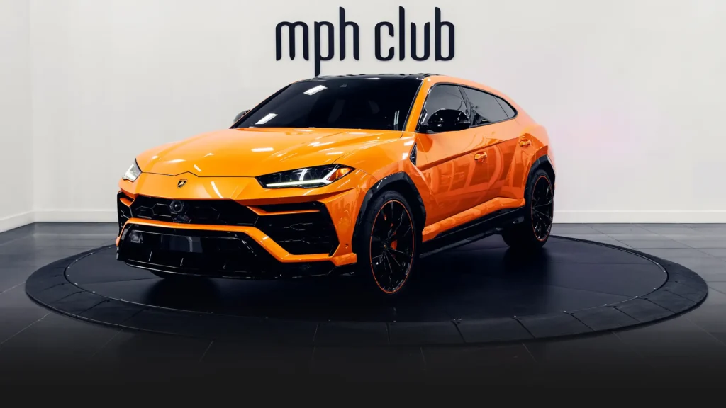 Orange Lamborghini Urus SUV rental profile view - mph club