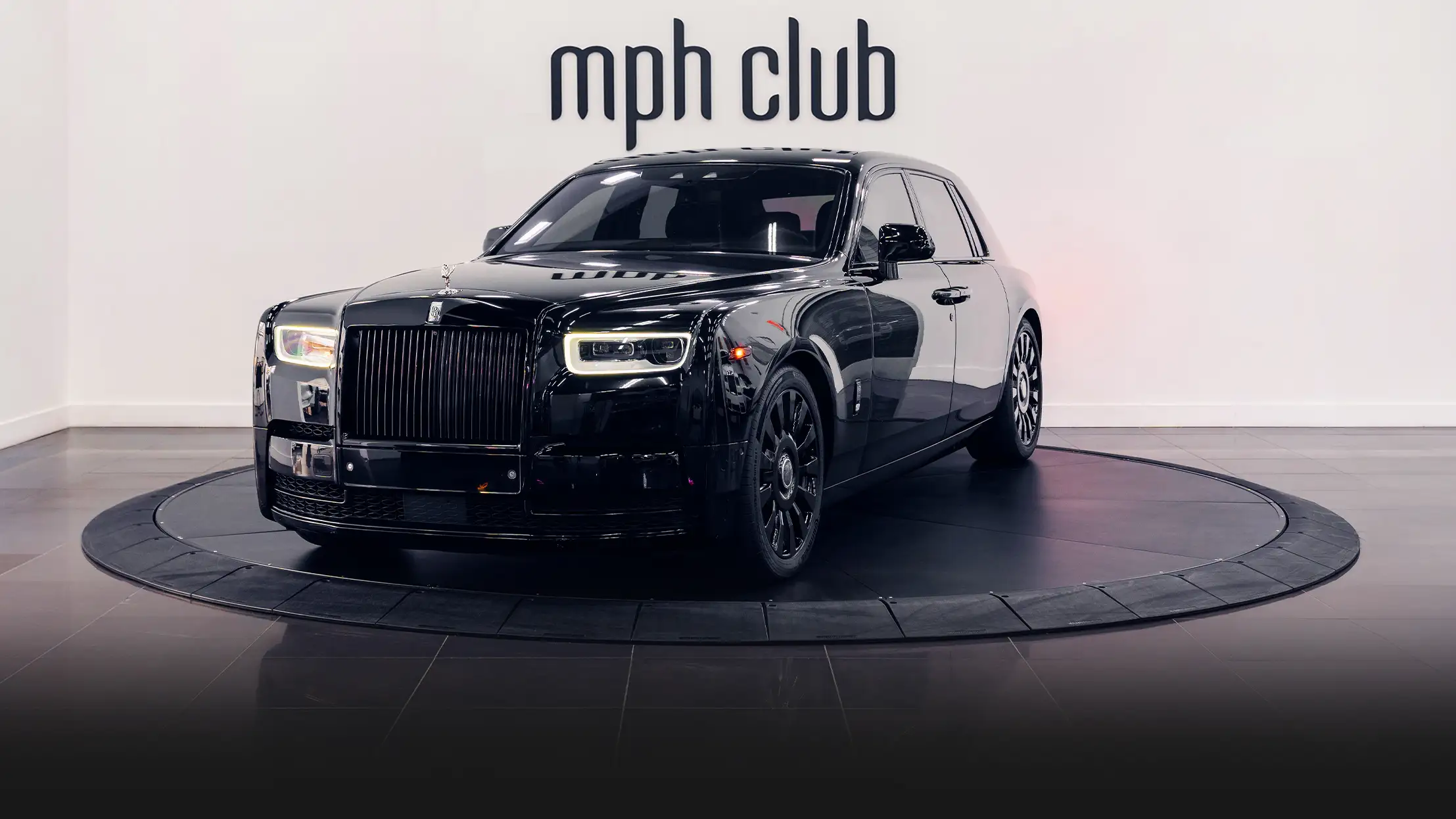 Black on black Rolls Royce Phantom rental profile view - mph club
