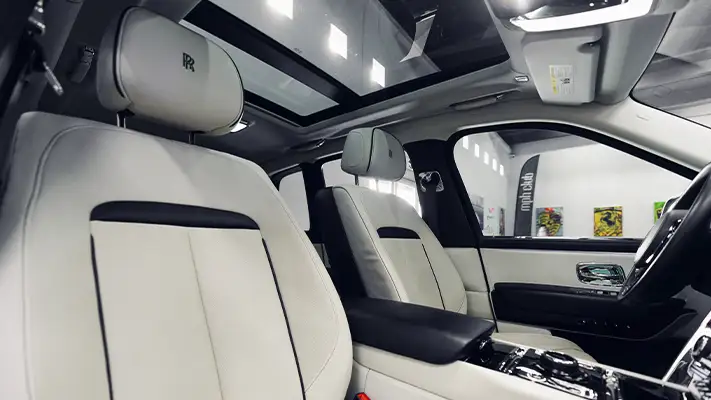 Grey on white Rolls Royce Cullinan rental interior view - mph club