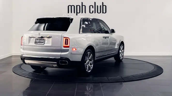 Grey on white Rolls Royce Cullinan rental rear view - mph club