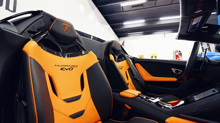 Blue with orange Lamborghini Huracan Evo Spider rental interior view turntable - mph club
