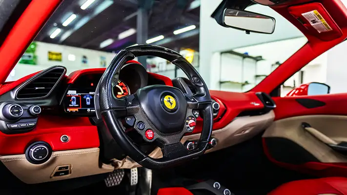 Red on red Ferrari 488 Spider for rent dashboard view - mph club