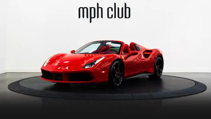 Red on red Ferrari 488 Spider for rent profile view - mph club rszd 1