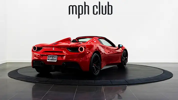 Red on red Ferrari 488 Spider for rent rear view - mph club