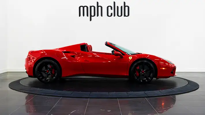 Red on red Ferrari 488 Spider for rent side view - mph club