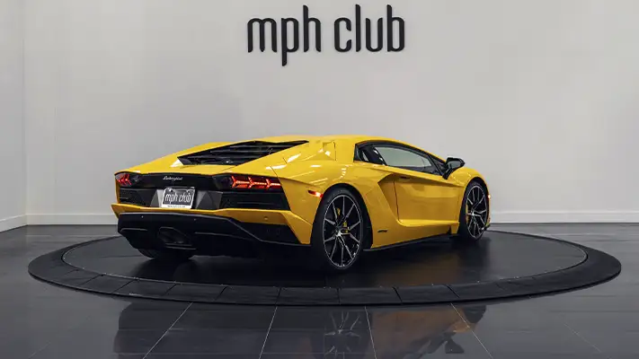 Yellow Lamborghini Aventador S rental rear view - mph club