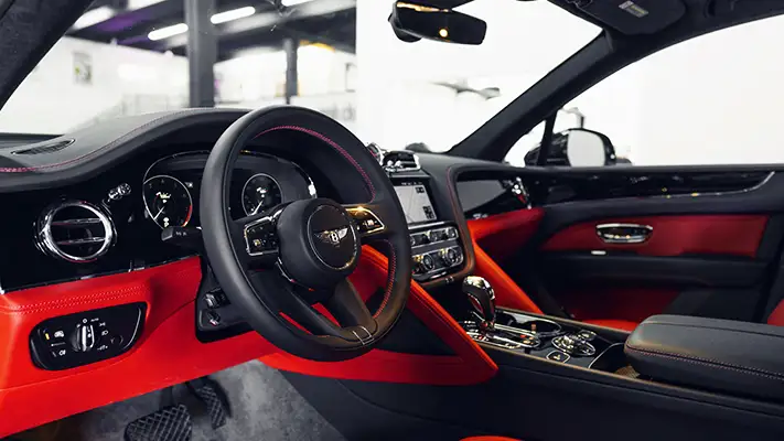 Black Bentley Bentayga rental dashboard view - mph club