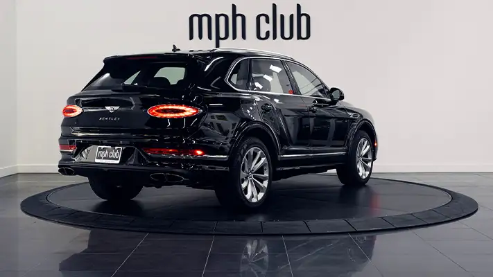Black Bentley Bentayga rental rear view - mph club