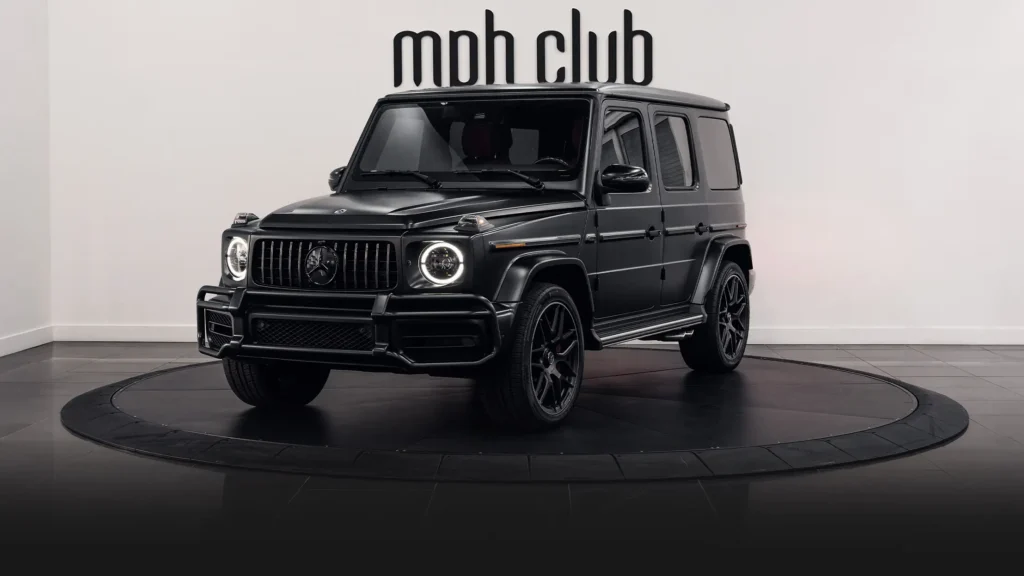 Black matte with red Mercedes Benz G63 rental profile view - mph club