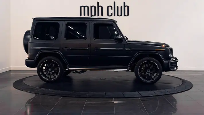 Black matte with red Mercedes Benz G63 rental side view - mph club